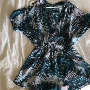 Tropical romper with V neck and shoulder detail